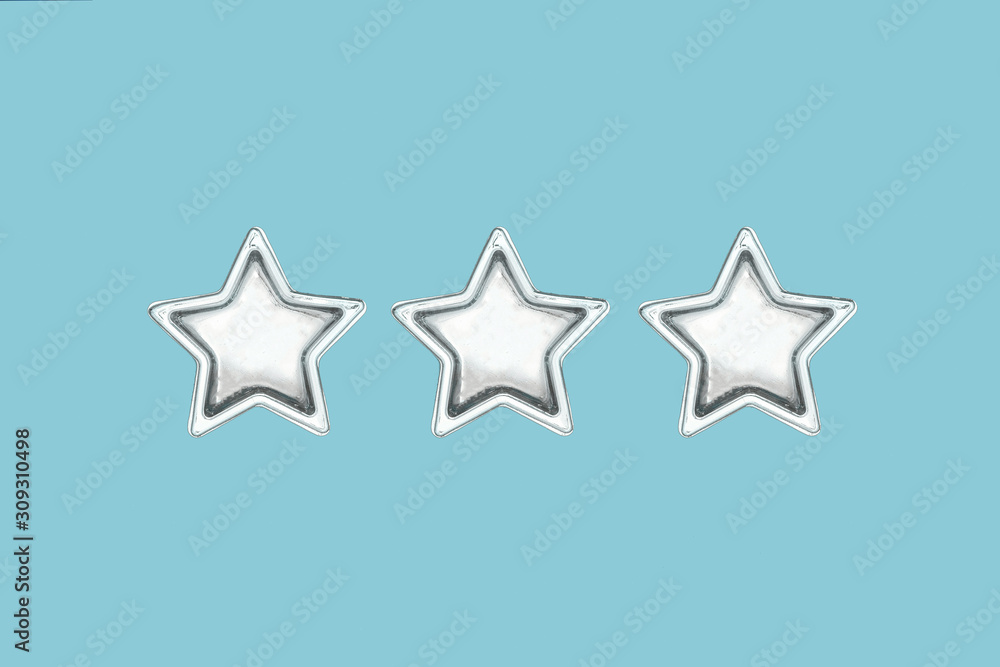 Obraz premium Christmas three five pointed golden stars on blue background. Christmas decoration.