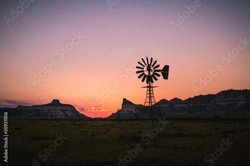windmill sunset in the scottsbluff nebraska photo