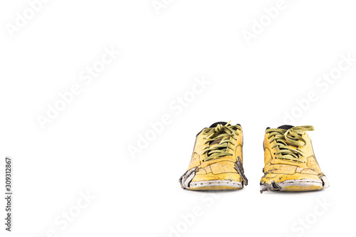 Old damaged synthetic futsal shoes on white background indoor soccer object isolated
