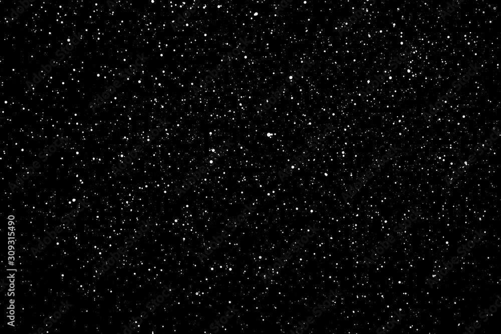 Chaotic white star bokeh on a isolated black background. falling blurry bokeh snow overlay, starry sky. white spots on black background, white drops and spots. abstraction.