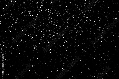 Chaotic white star bokeh on a isolated black background. falling blurry bokeh snow overlay, starry sky. white spots on black background, white drops and spots. abstraction.