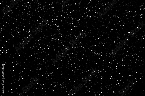 Chaotic white star bokeh on a isolated black background. falling blurry bokeh snow overlay, starry sky. white spots on black background, white drops and spots. abstraction.