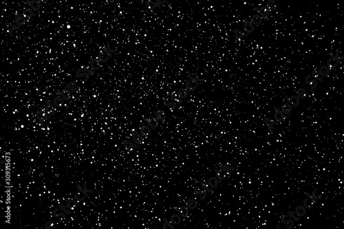 Chaotic white star bokeh on a isolated black background. falling blurry bokeh snow overlay, starry sky. white spots on black background, white drops and spots. abstraction.