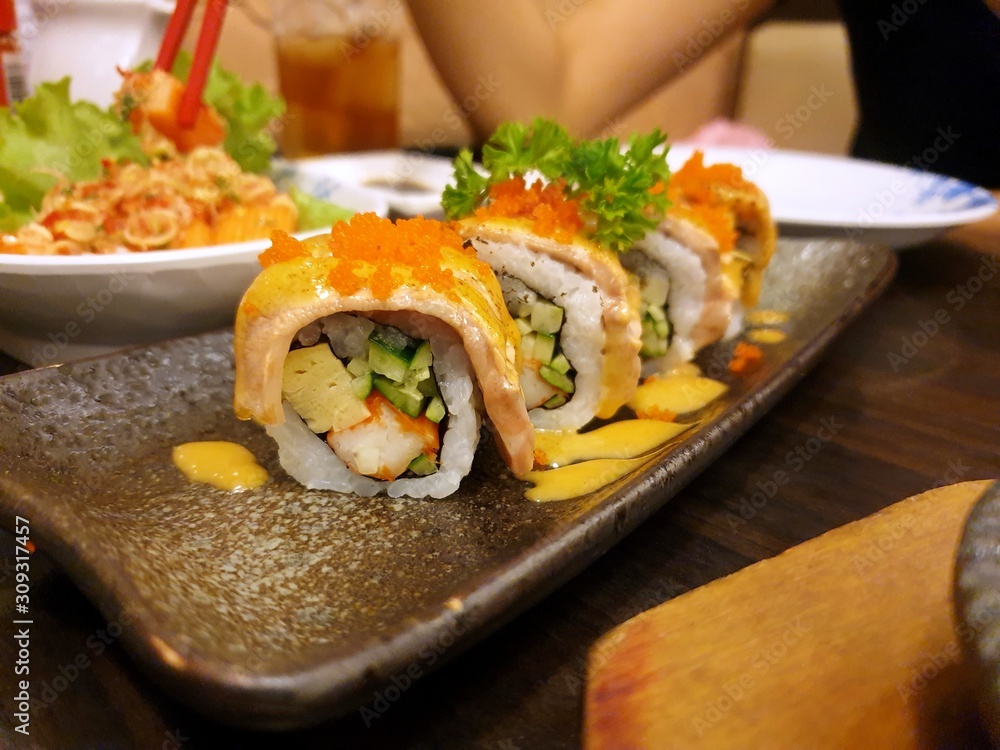 Japanese food style, Selective focus of salmon aburi sushi topped with beluga caviar in restaurant, Ready to eat or serve Japanese food style, Selective focus of salmon aburi sushi topped with beluga caviar in restaurant, Ready to eat or serve