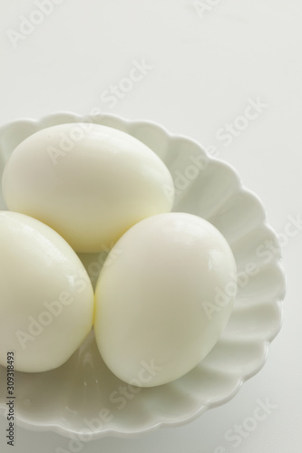 Homemade boiled egg on white plate for food ingredient,