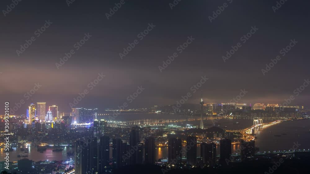 Macau Peninsula night districts by bridge in China timelapse Macau Peninsula night districts by bridge in China timelapse