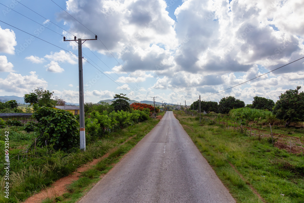 Fototapeta premium Aerial view of a scenic road in a country side near La Boca, Trinidad, Cuba.