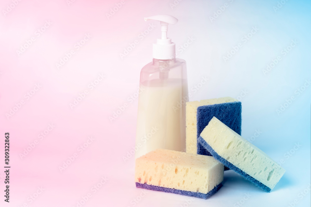 Sponges for washing dishes and detergent in a plastic bottle with a dispenser, tinted Sponges for washing dishes and detergent in a plastic bottle with a dispenser, tinted
