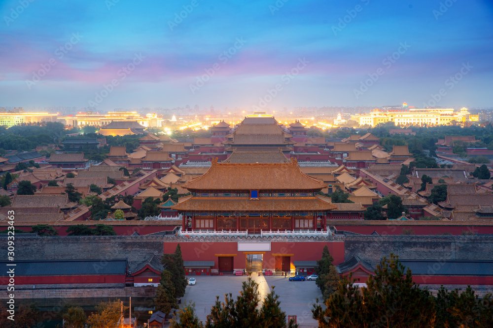 Aerial bird view of the architecture building and decoration of the Forbidden City at night in Beijing, China. Asian tourism, history building, or tradition culture and travel concept.