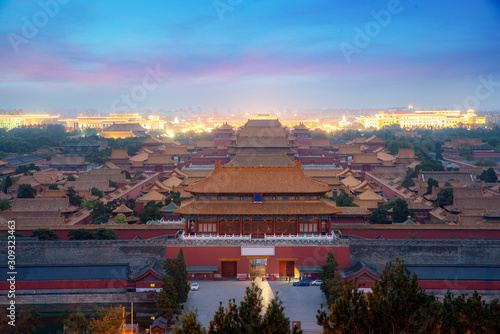 Aerial bird view of the architecture building and decoration of the Forbidden City at night in Beijing, China. Asian tourism, history building, or tradition culture and travel concept.