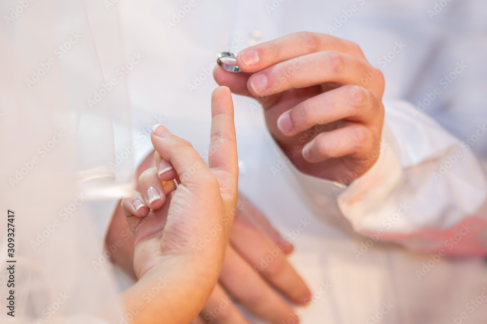 Jewish wedding. Jewish groom puts a ring on the finger of a Jewish bride. Jewish wedding. Jewish groom puts a ring on the finger of a Jewish bride.