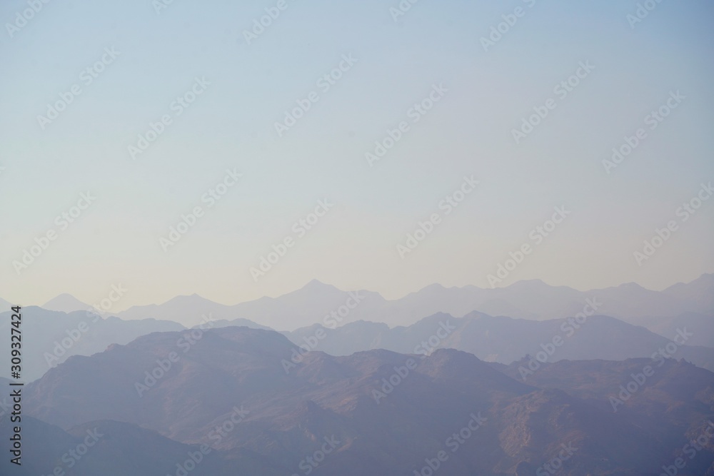 fog and clouds over Hajar mountains in Dibba