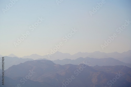 fog and clouds over Hajar mountains in Dibba