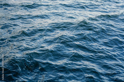 Waves on transparent water surface