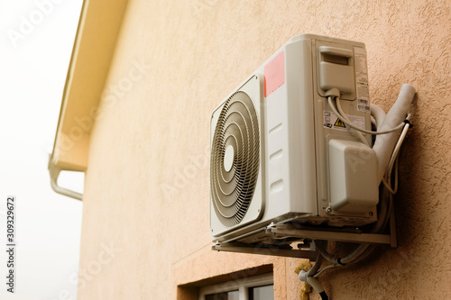 air conditioner device on house facade