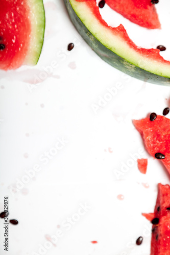 Red ripe sliced ​​watermelon on white background