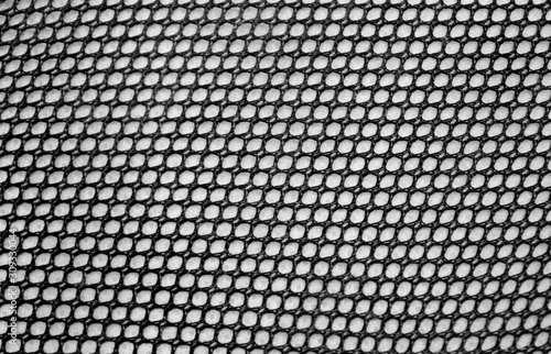 Black Background Mesh fabric texture. Top View of Cloth Textile Surface. 