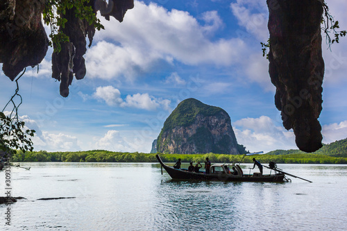 Tourist boat for taking in the sea and mountain scenery in the middle of Sikao Bay, Trang, Thailand