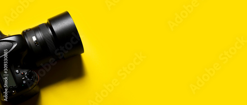 dslr photography camera isolated on yellow background. ds.r camera concept