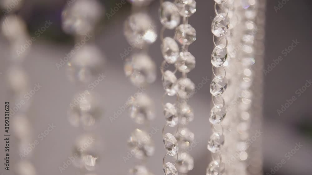 moving hanging crystal chandelier closeup. defocused abstract bokeh shot. elegant expensive background. luxury chrystal blur. concept rich, blurred, diamond. classic item moving hanging crystal chandelier closeup. defocused abstract bokeh shot. elegant expensive background. luxury chrystal blur. concept rich, blurred, diamond. classic item