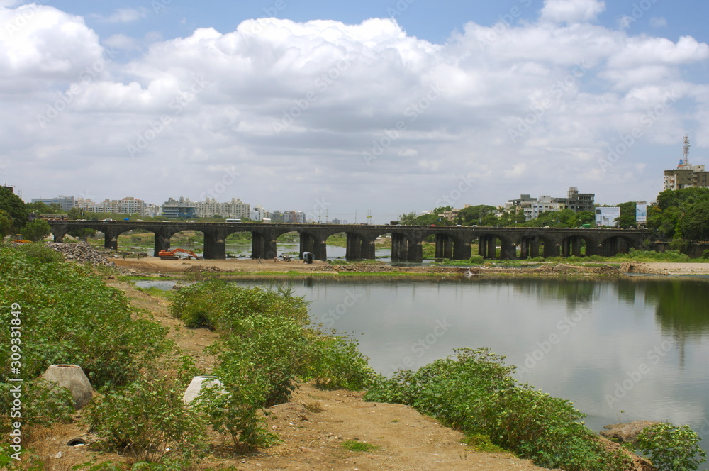 Naklejka premium View of the old Bund Garden Bridge (formerly Fitzgerald Bridge), Yerwada, Pune, Maharashtra, INDIA. HORIZONTAL IMAGE
