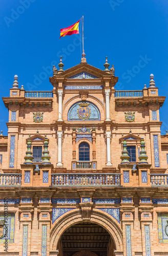 Spanish flag on the main building of the Plaza Espana in Sevilla, Spain