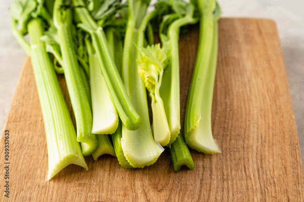 Celery. Leaves and stem of fresh organic green celery close up. Healthy eating, vegetarian food, diet, dieting concept.