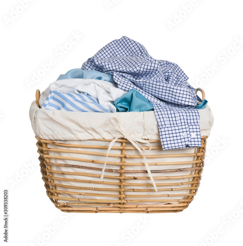 Tableau sur toile Vintage wicker basket with laundry isolated on white background