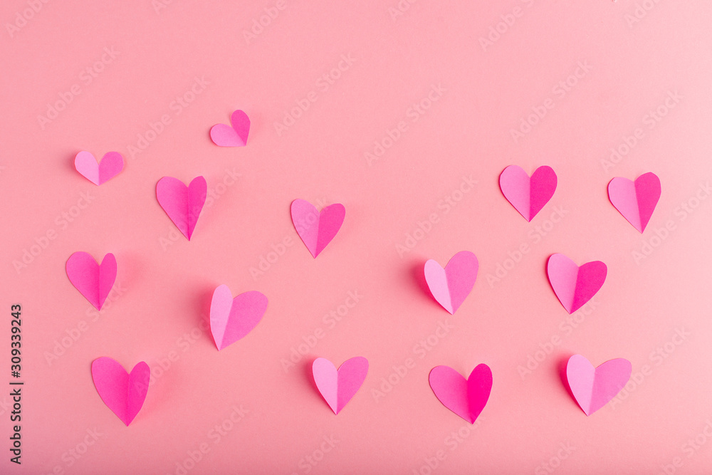 background with pink hearts made of paper