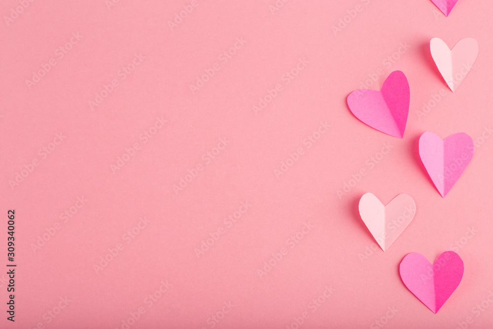 background with pink hearts made of paper