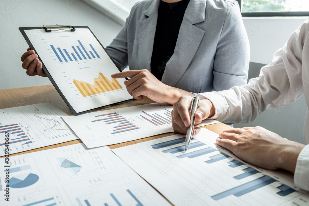 Two business leader discussing the charts and graphs showing the results, Planning to start new strategy for big success Two business leader discussing the charts and graphs showing the results, Planning to start new strategy for big success
