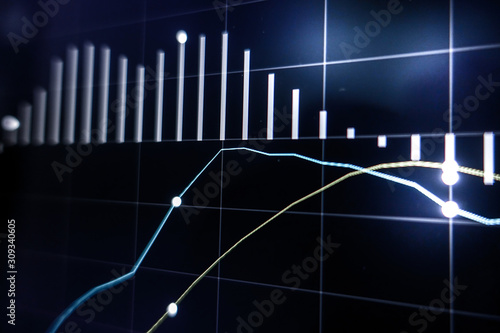 Stock market graph on laptop screen for business or economic concept.