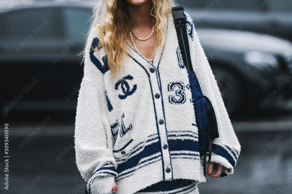 Paris, France - March 05, 2019: Street style outfit - Fashionable person  wearing Chanel after a fashion show during Paris Fashion Week - PFWFW19  Stock Photo