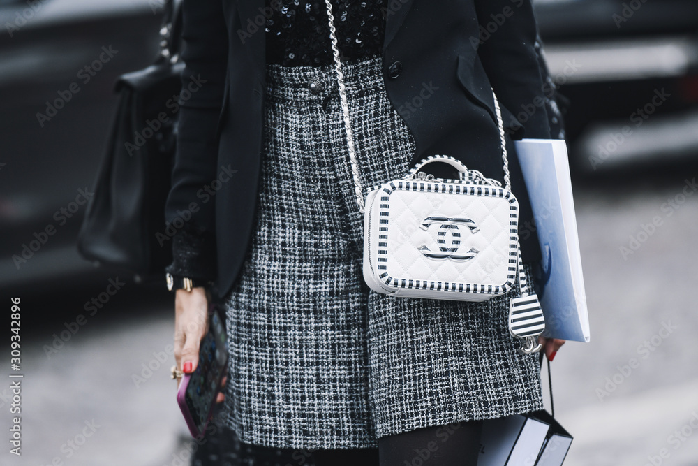 Paris, France - March 05, 2019: Street style outfit - Woman wearing Chanel  purse after a fashion show during Paris Fashion Week - PFWFW19 Stock Photo  | Adobe Stock