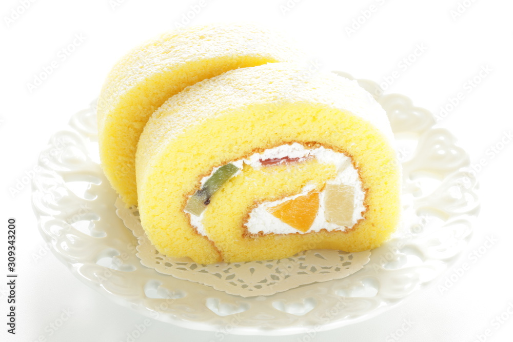 mixed fruit Swiss roll on dish mixed fruit Swiss roll on dish