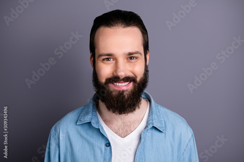 Closeup photo of toothy smiling macho guy perfect appearance neat long hairdo bristle young promoted chief wear casual denim outfit isolated grey color background