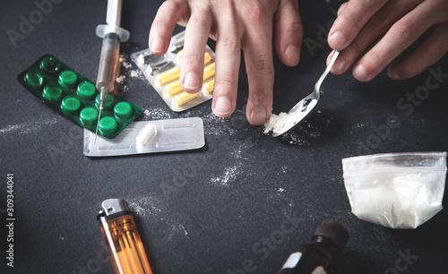 Drug addict taking cocaine. Addiction