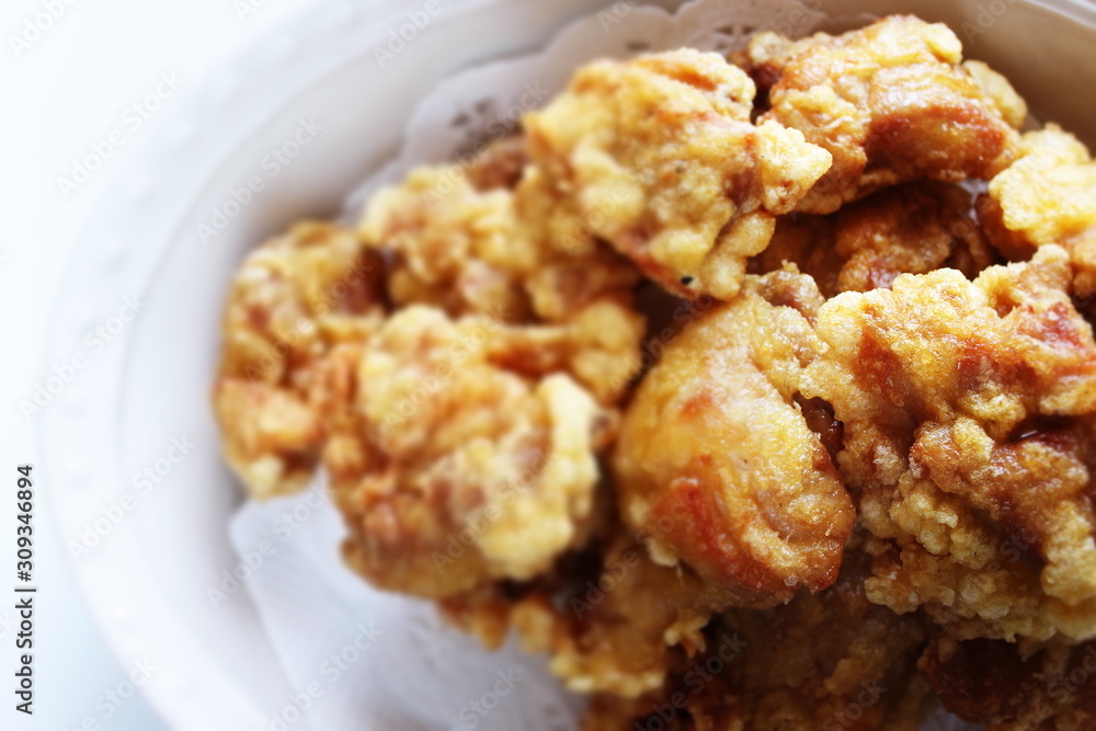 Asian food, fried chicken in bowl with copy space Asian food, fried chicken in bowl with copy space