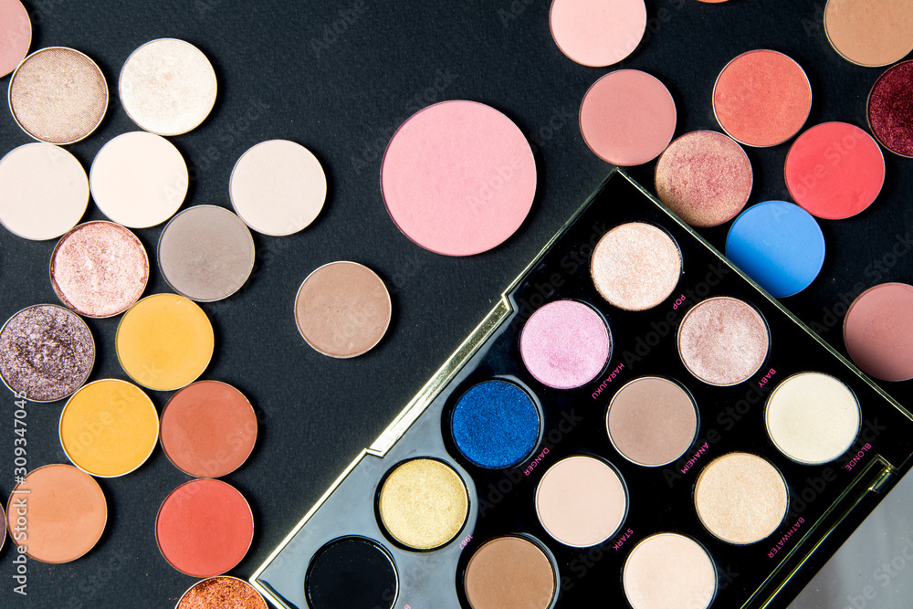 Make-up colorful eye shadow palettes isolated on black background. Make-up colorful eye shadow palettes isolated on black background.