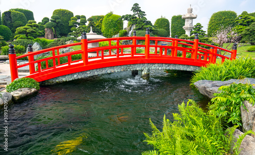 Red bridge in the park Japanese rock gardens as decoration for the garden accents lively culture represents Japan in nature