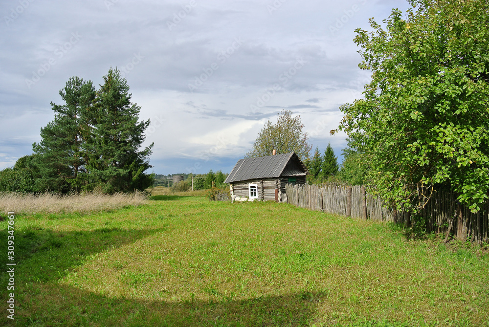 small rural bath next to the garden and field