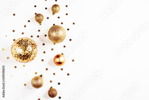 Gold Christmas balls top view, on a white background, ornament, flat lay