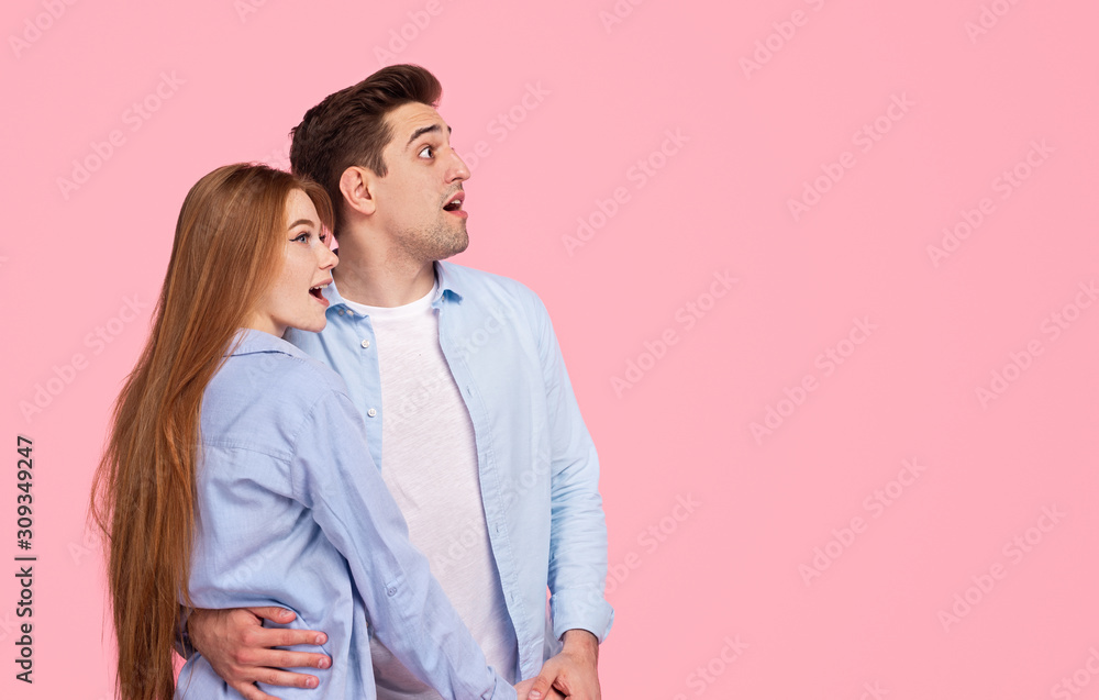Fototapeta premium Amazed couple looking away together