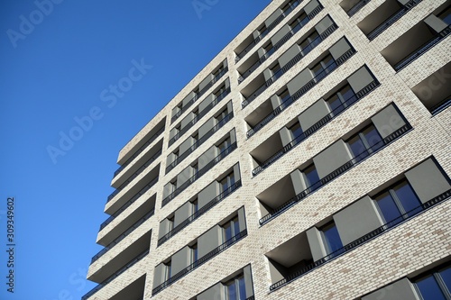 Modern and new apartment building. Multistoried modern, new and stylish living block of flats.