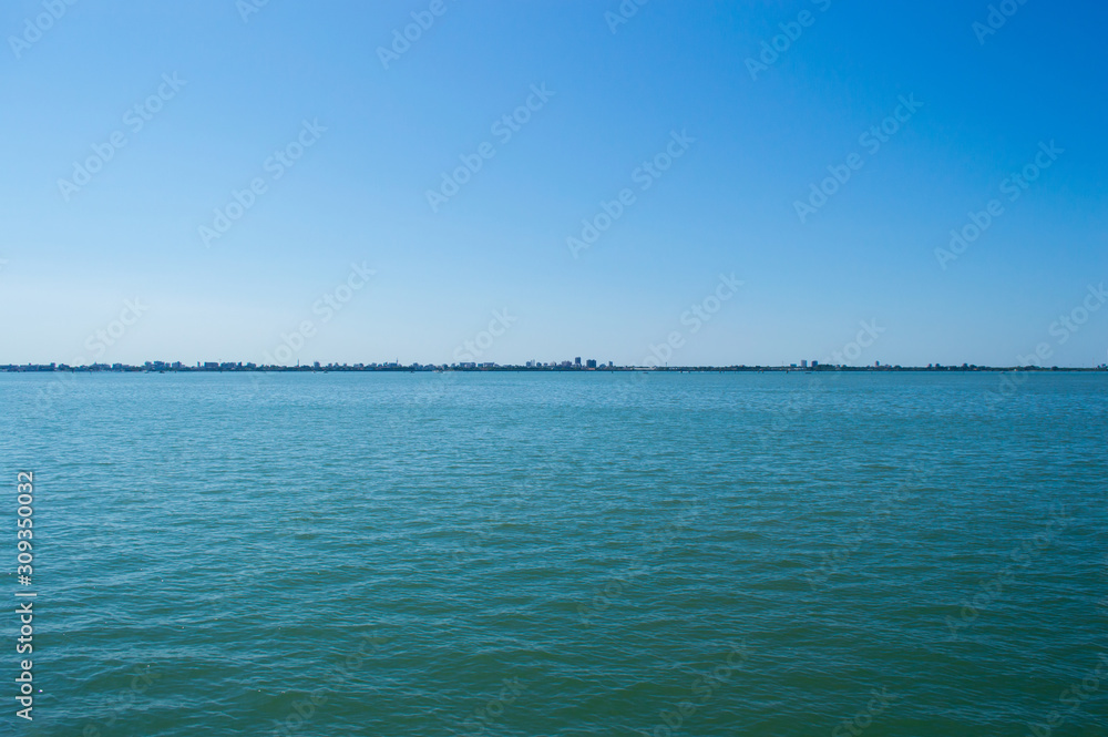 City silhouette on the sea horizon