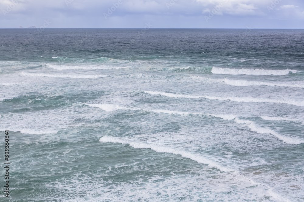 View at the Atlantic ocean on Portugal with Berlengas island on background View at the Atlantic ocean on Portugal with Berlengas island on background