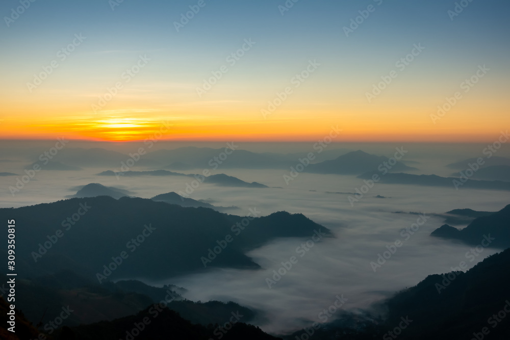 Beautiful landscape nature on peak mountain with sunset in winter at viewpoint Phu Chi Fa or Phu chee fah Forest Park in Chiang Rai , Thailand