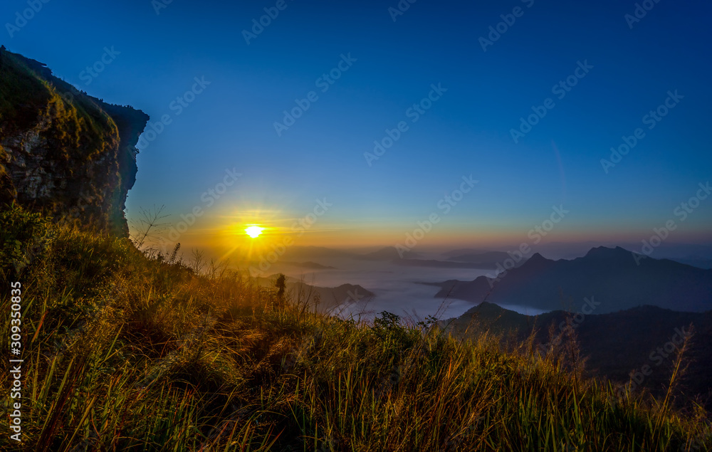 Sunrise and sea of mist, Mountain at Phu chee fa or Phu chi fa in Chiangrai province ,Thailand.
