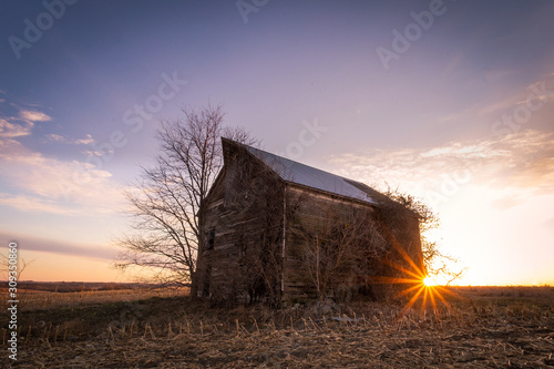 old barn in sunset photo
