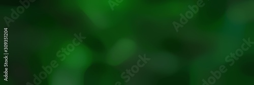 blurred horizontal background with very dark green, green and very dark blue colors and free text space